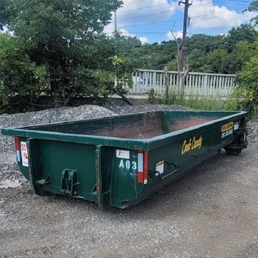 Green dumpster labeled 