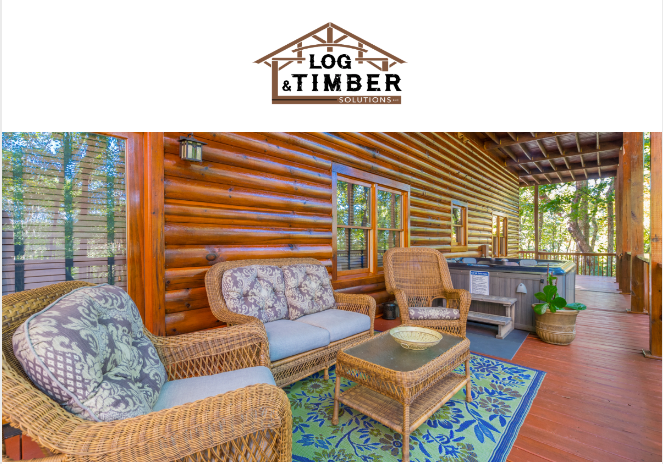 A log cabin with wicker furniture and a hot tub