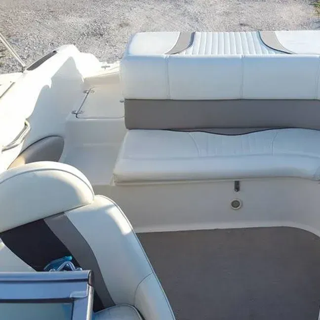 Boat interior with white and gray seats.