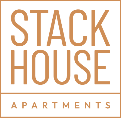 The logo for stack house apartments is brown and white