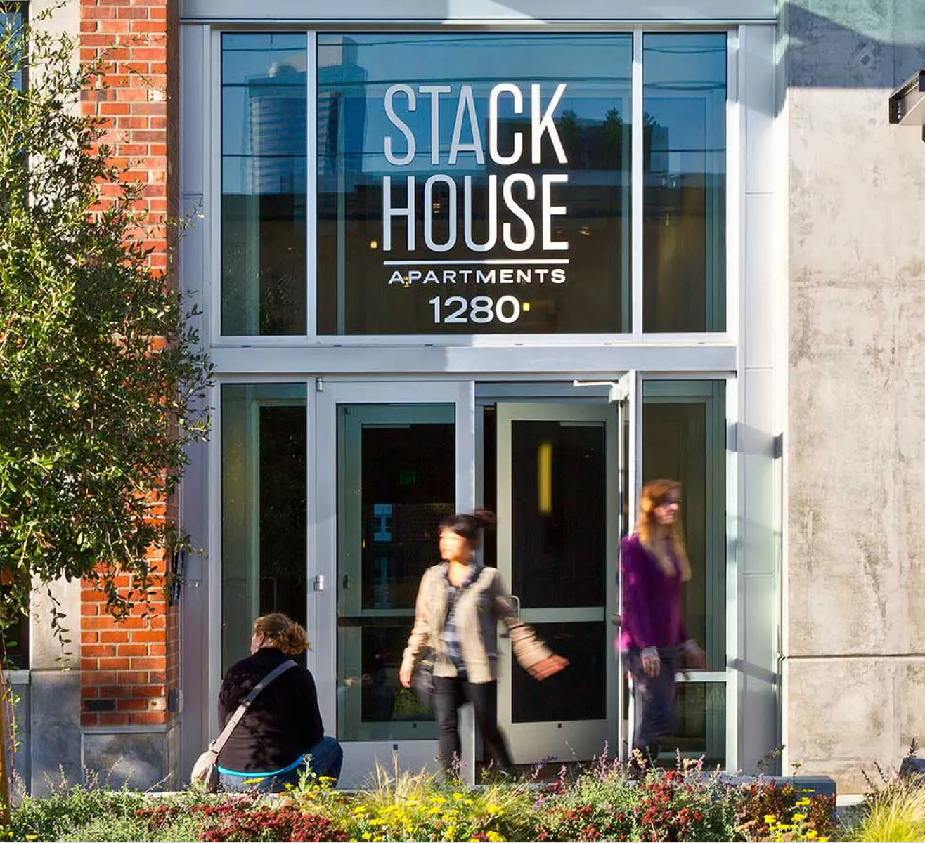 People are entering the stack house apartment building