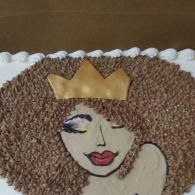 Stylized face with crown in brown and cream mosaic-like texture