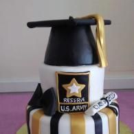 White and black military-themed cake with gold accents and a “RESERVE U.S. ARMY” emblem