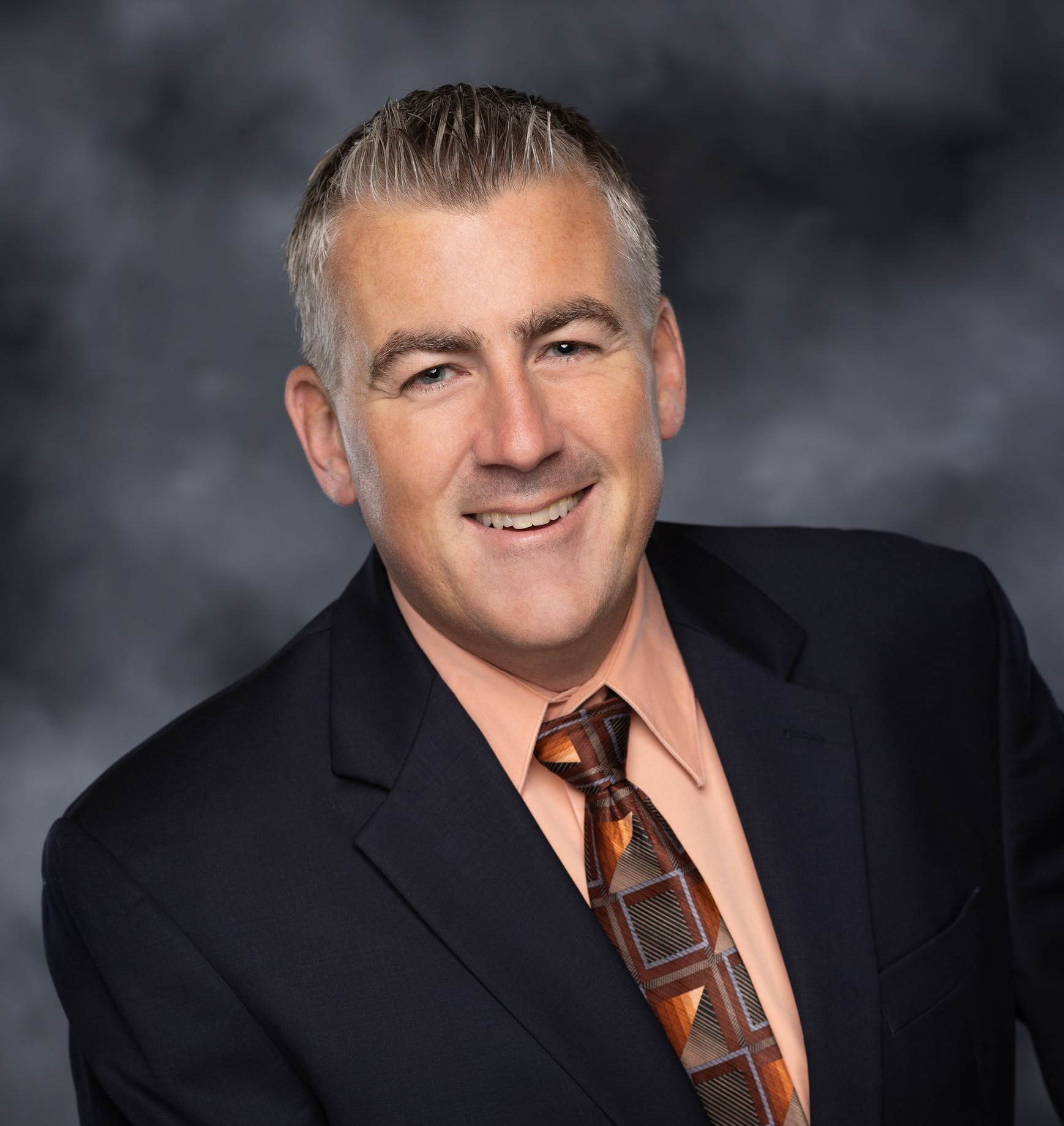 A black and white headshot of Charles Fleet