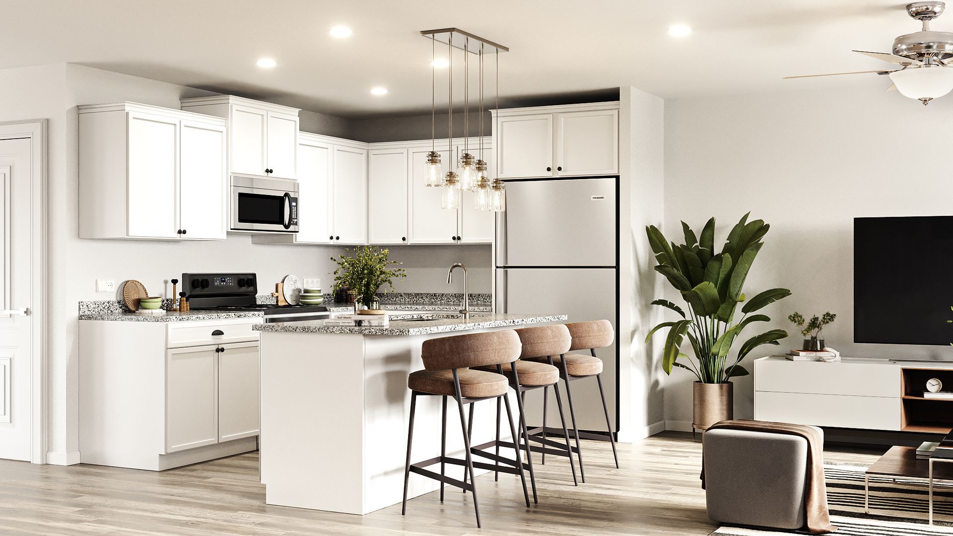 Bright kitchen with white cabinets, island, and stainless steel appliances. Bar stools, large plant, and TV present.