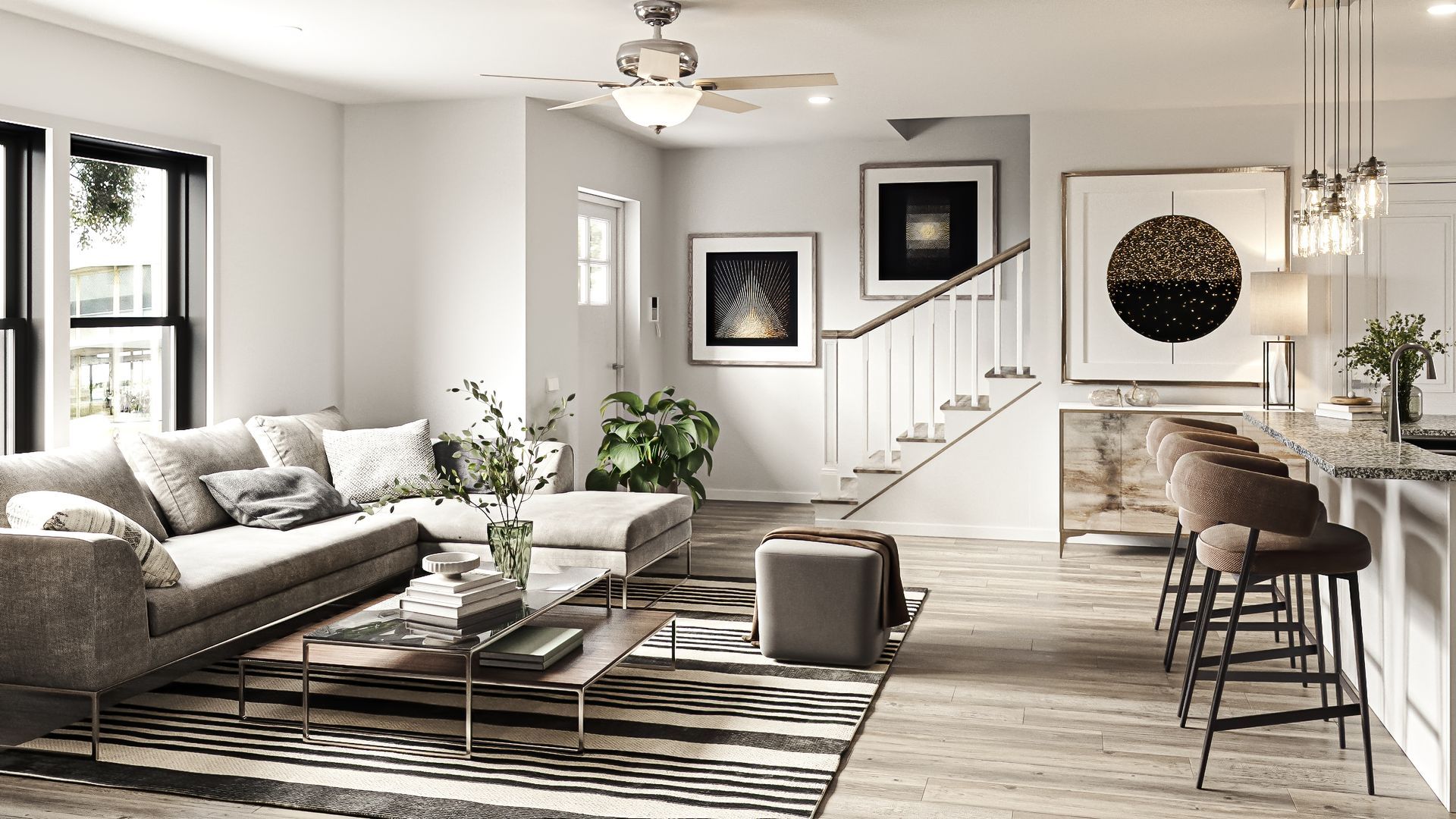 Modern living room with a sectional sofa, artwork, and a kitchen bar.