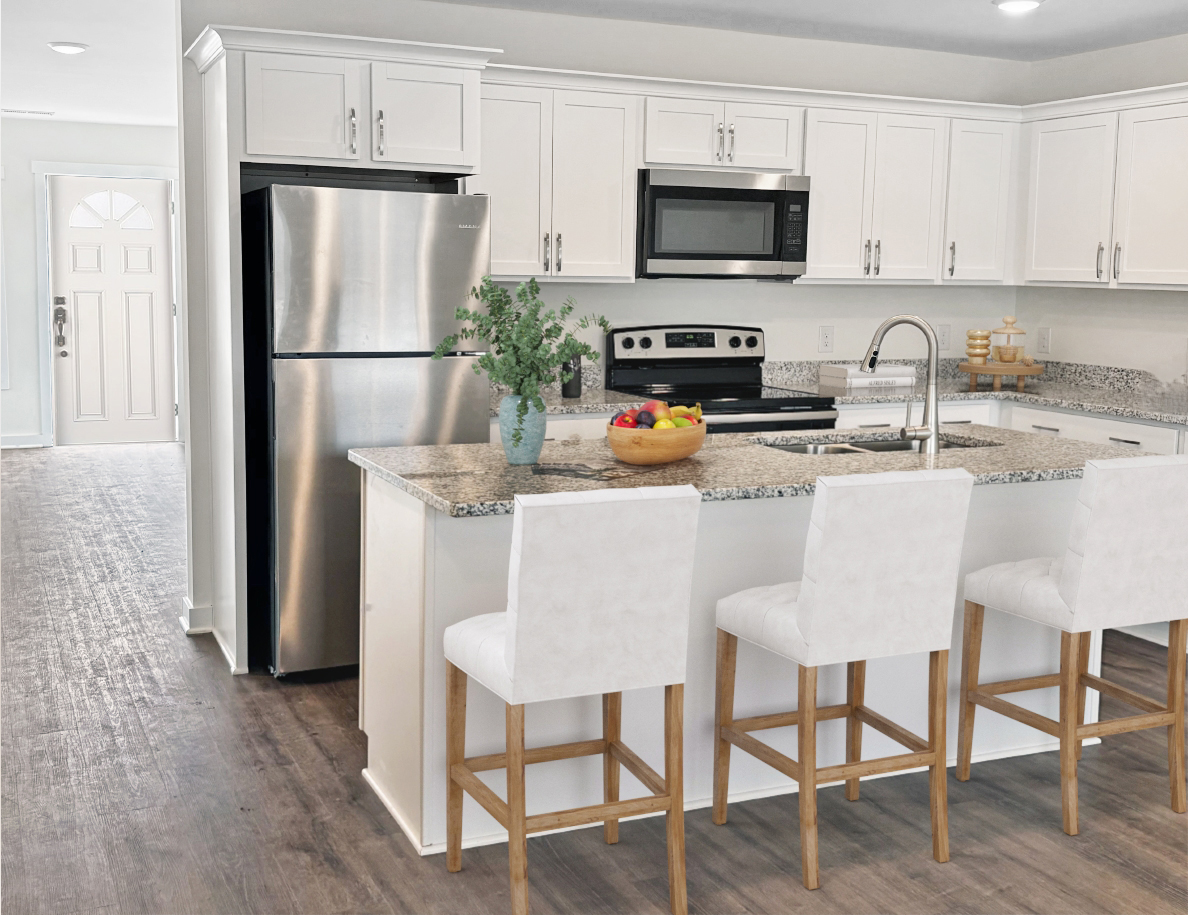 White kitchen with island, stainless steel fridge, and bar stools.
