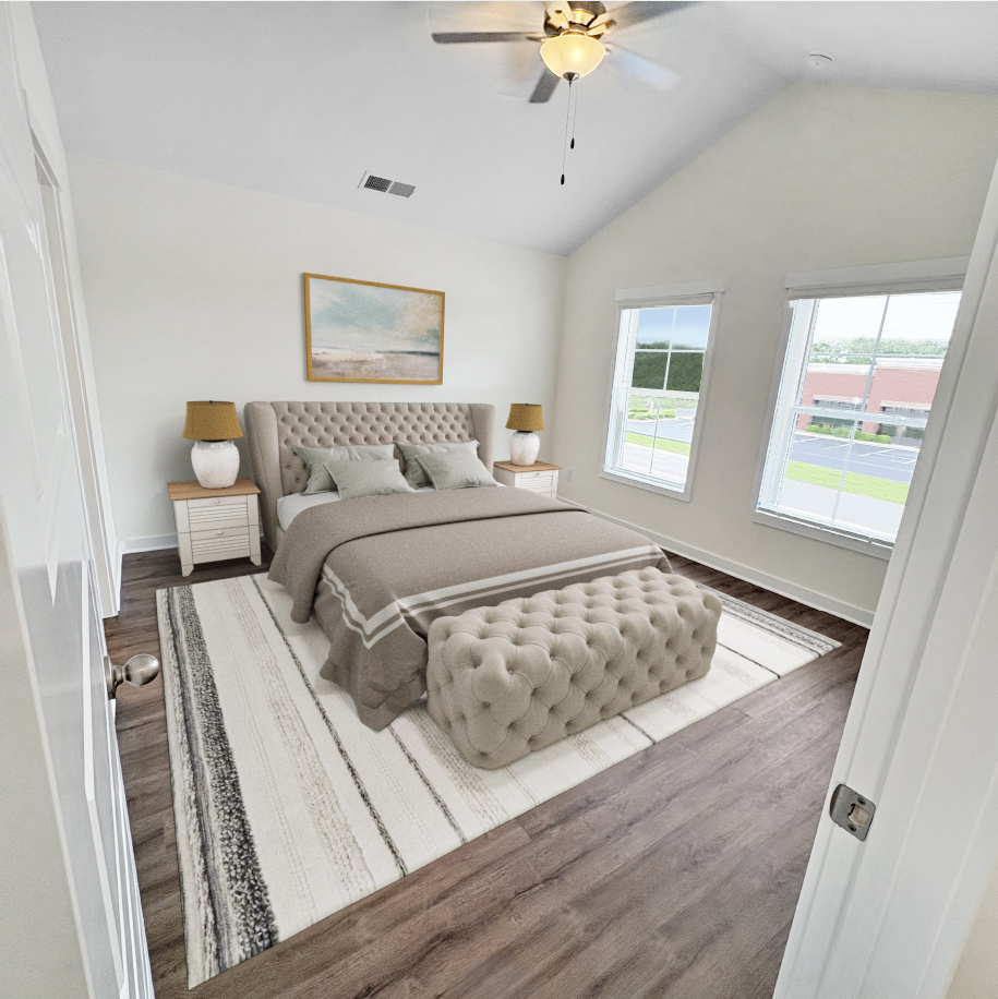 Bedroom with bed, two windows, neutral color scheme, vaulted ceiling, and a rug.