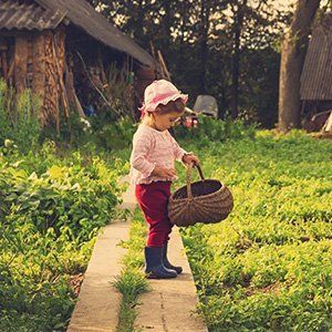 little girl holding a wicker basket