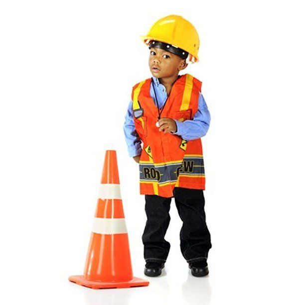 boy wearing safety hat and vest