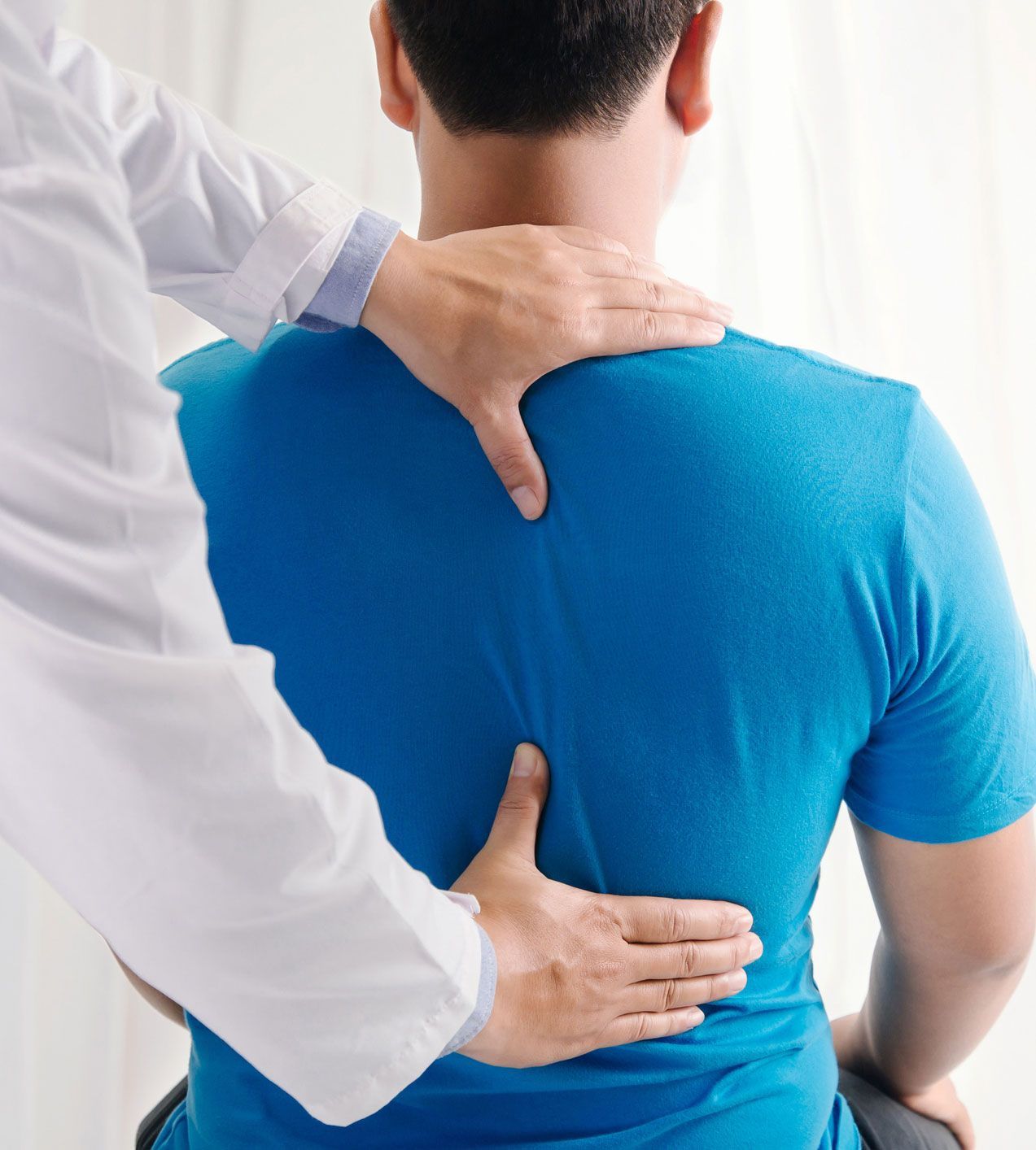 Chiropractor Checking Man's Back — Ponte Vedra Beach, FL — Science Based Wellness & Chiropractic