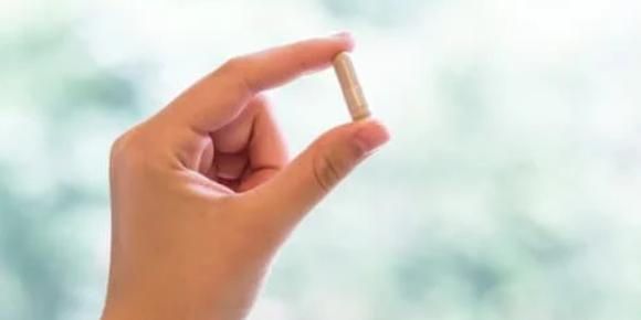 Holding A Capsule — Ponte Vedra Beach, FL — Science Based Wellness & Chiropractic