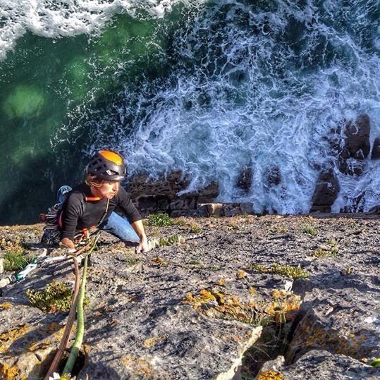 Climber high above the sea