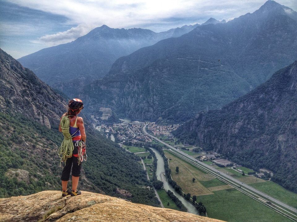 Female climber looking out over a valley