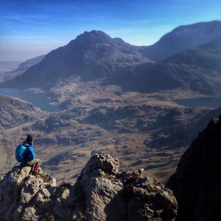Walker sitting on the edge of a cliff
