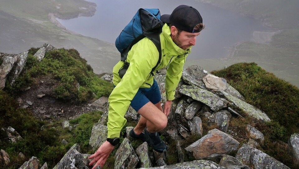 Female runner going through the forest