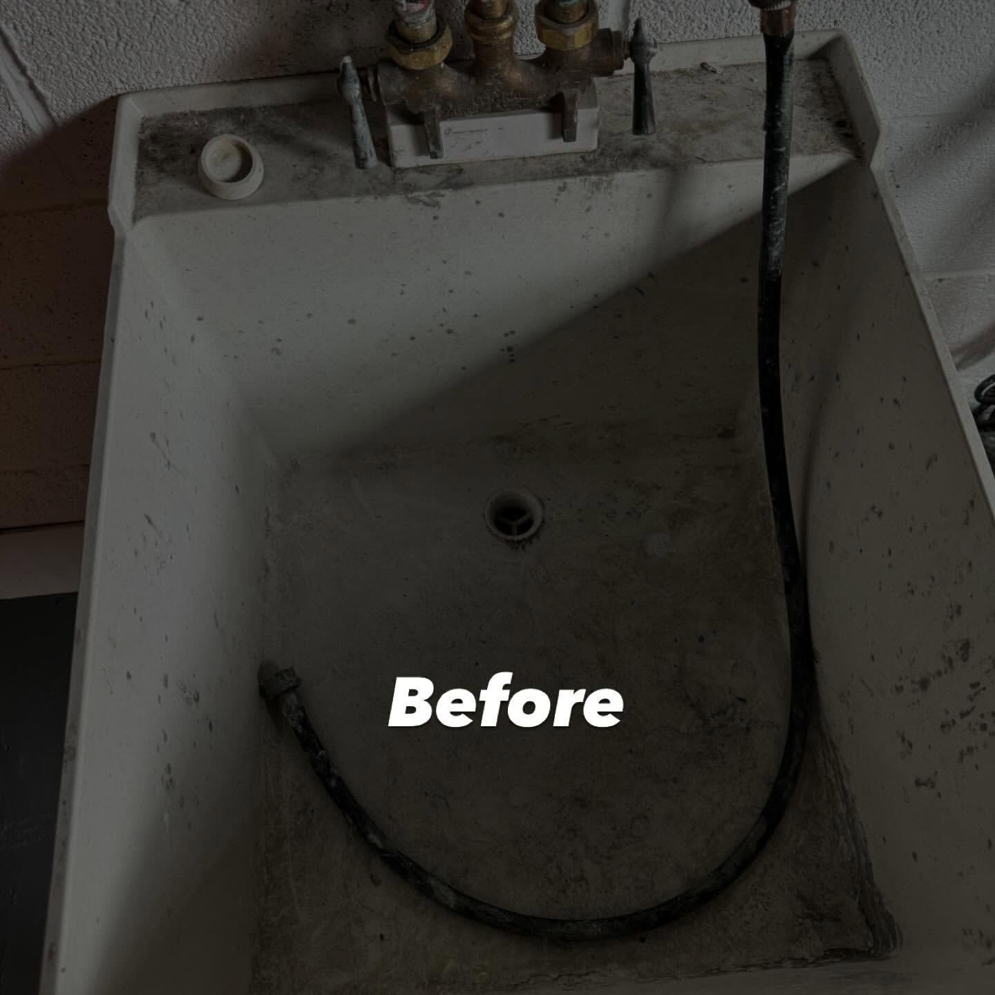Dirty utility sink with spigot and hose.