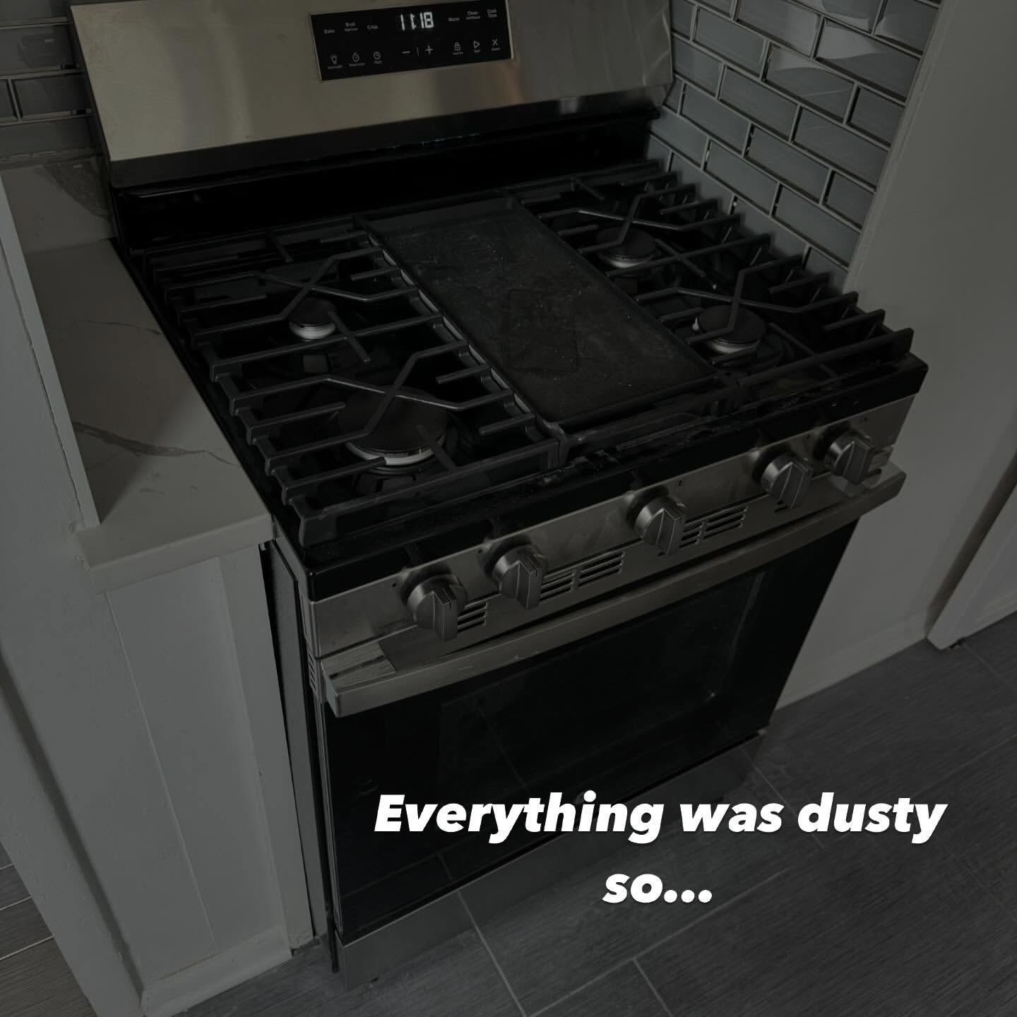 A dusty stainless steel stove in a kitchen. Text overlay reads 
