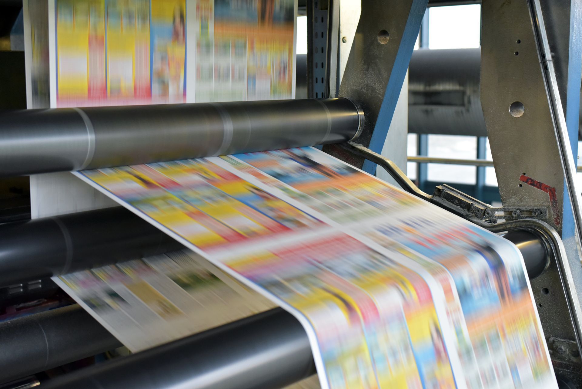 Custom Promotional Product printing in progress on a commercial offset press. Custom Promotional Product printing in progress on a commercial offset press.