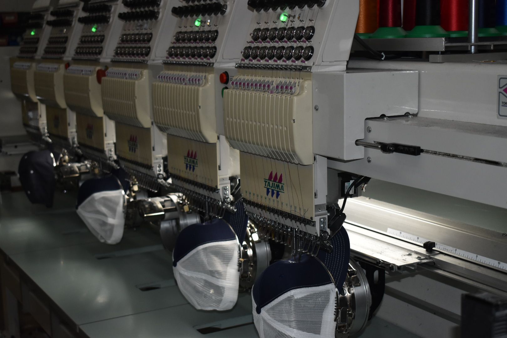 A person is using a screen printing machine.