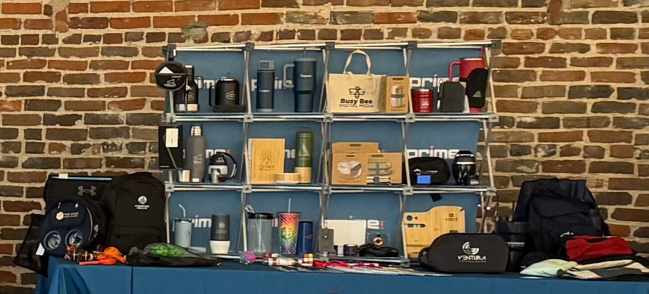 A person is typing on a laptop with icons coming out of the screen.