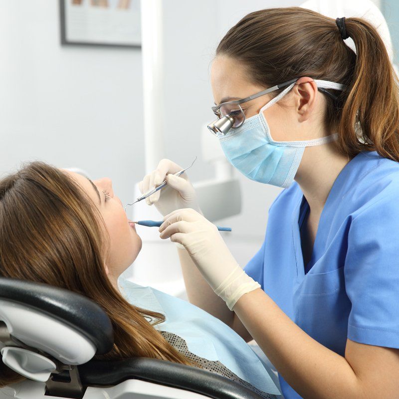 Dentist Examining a Patient Teeth — Bunbury WA — FADC Dental Group