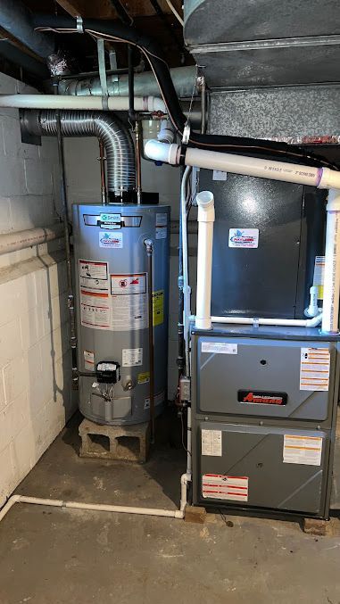 There is a water heater and an air conditioner in the basement.