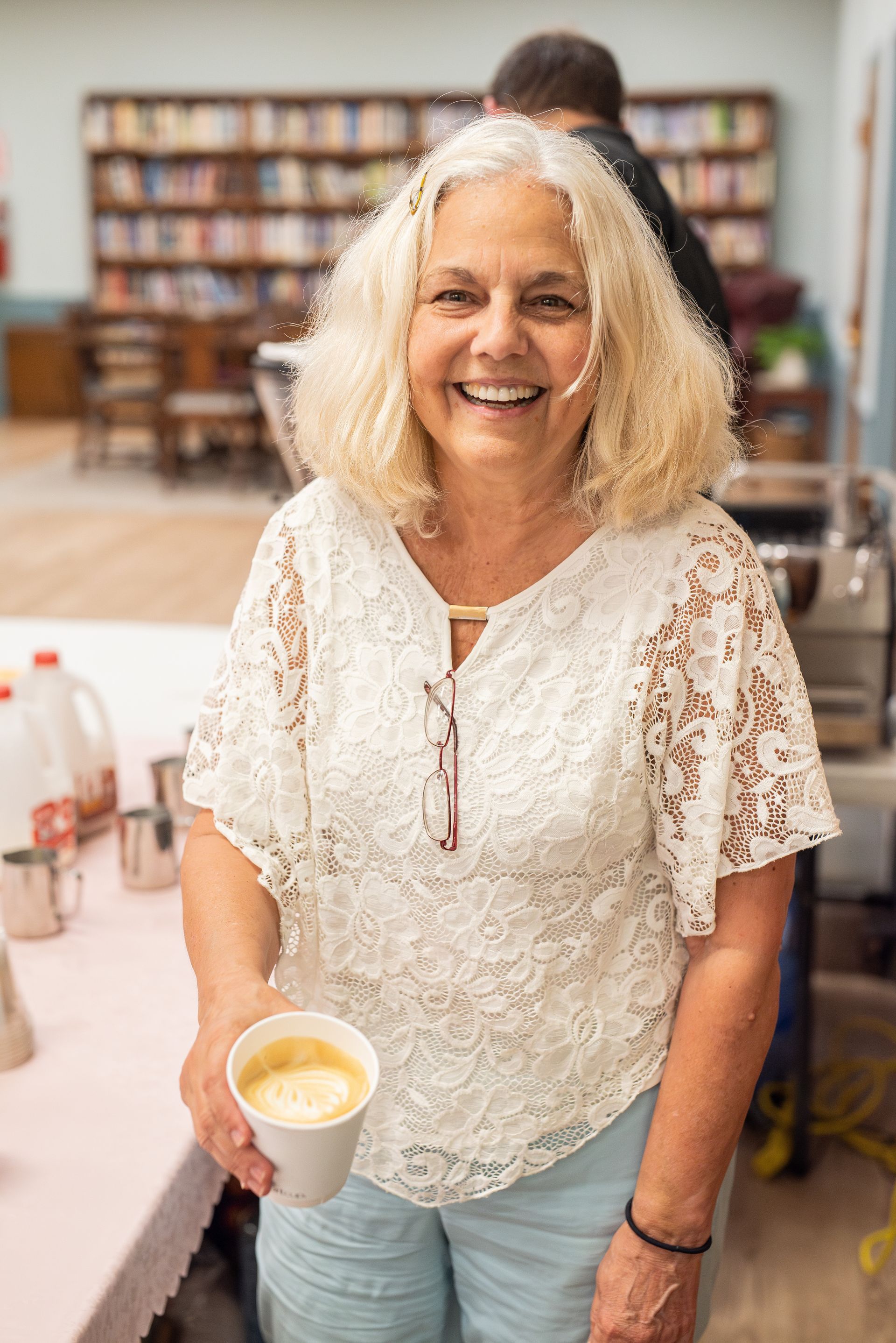church member smiling with coffee