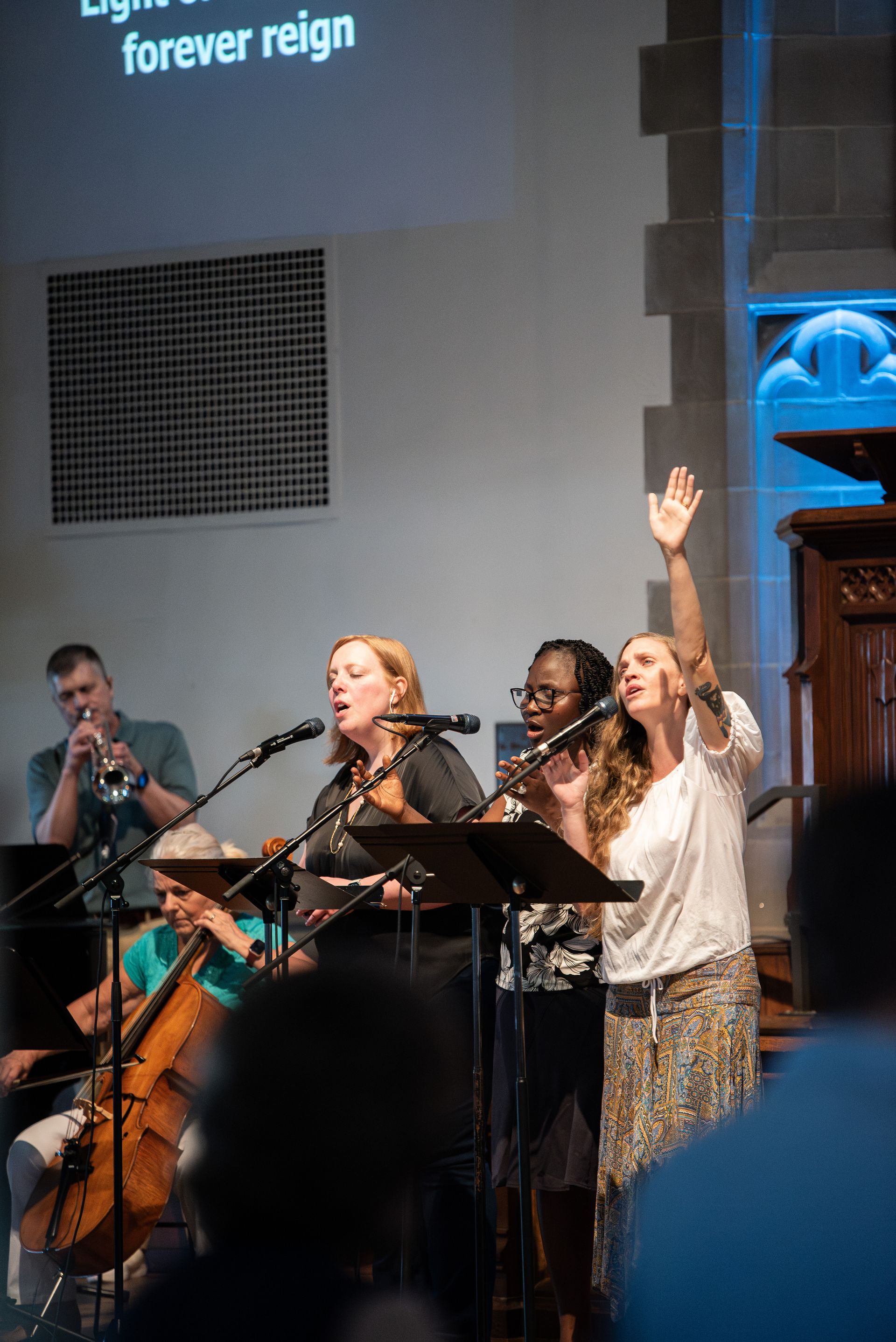 Worship service with hands raised
