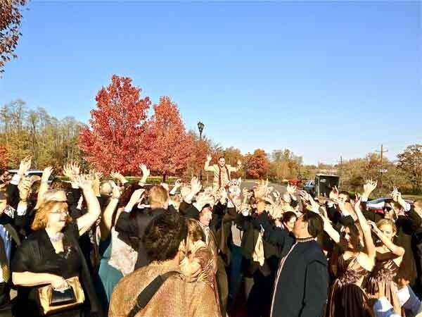 people lifting groom at indian wedding