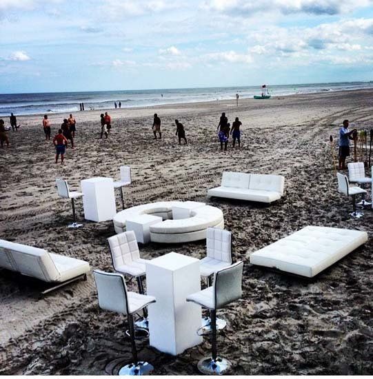 white lounge furniture and decor on the beach