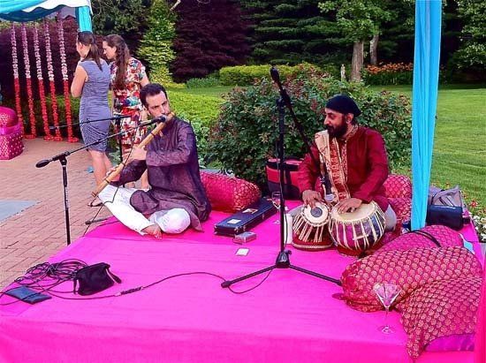 playing instruments on pink blanket