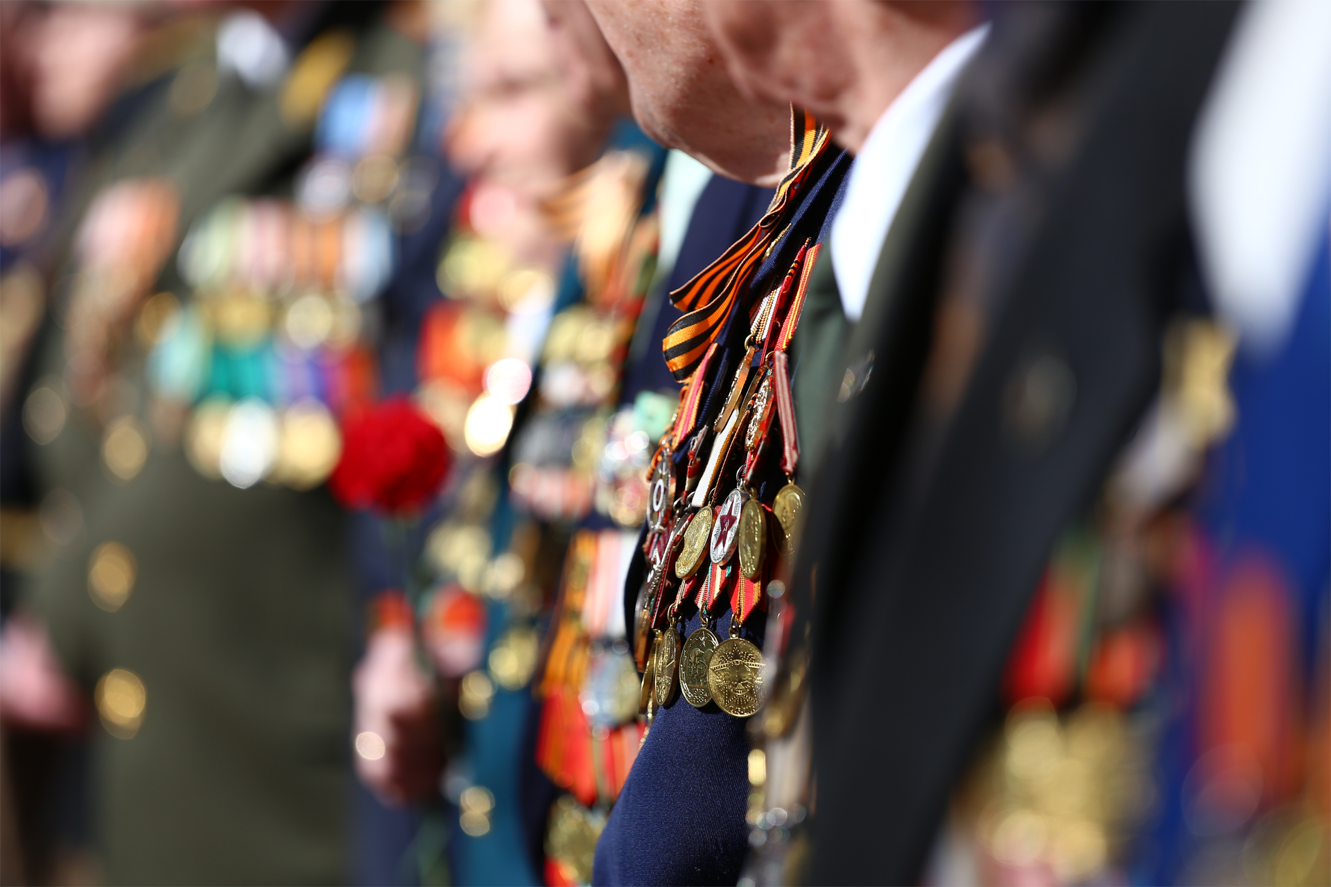 A group of men in military uniforms are standing in a line.