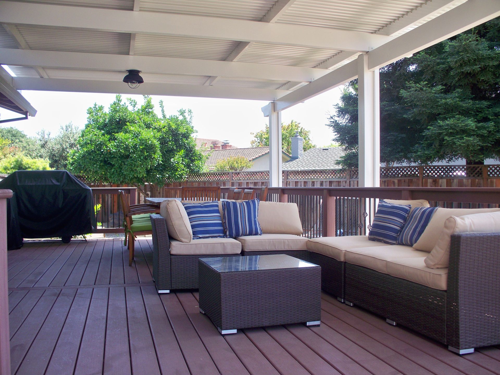 Solid Patio Cover Protecting Furniture on Deck in Concord, CA