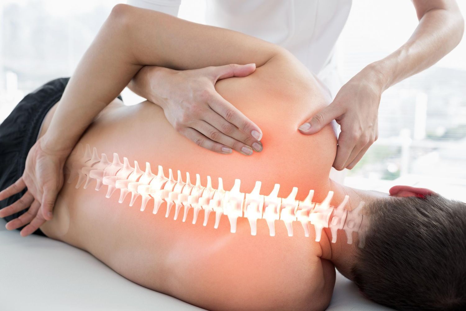 Person receiving a back massage with a glowing spine graphic overlay