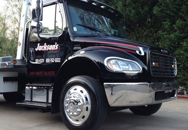 A flatbed tow truck A flatbed tow truck