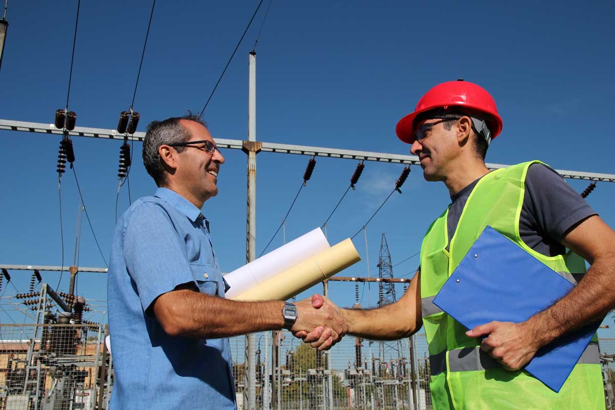 electrician shaking hands