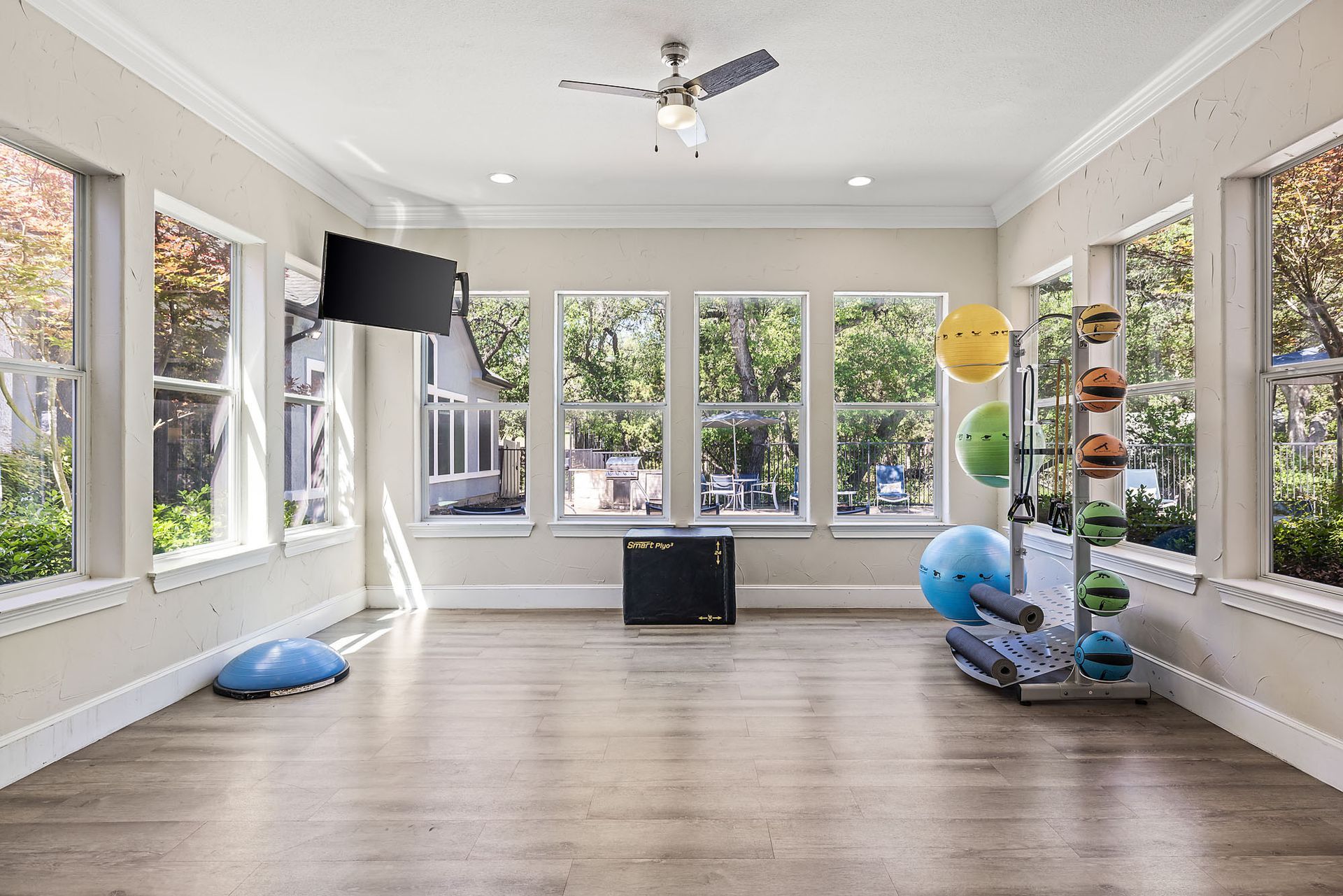 Gym with weights and weight machines, along with a weight bench at Marquis at TPC, offers San Antonio apartments for rent.