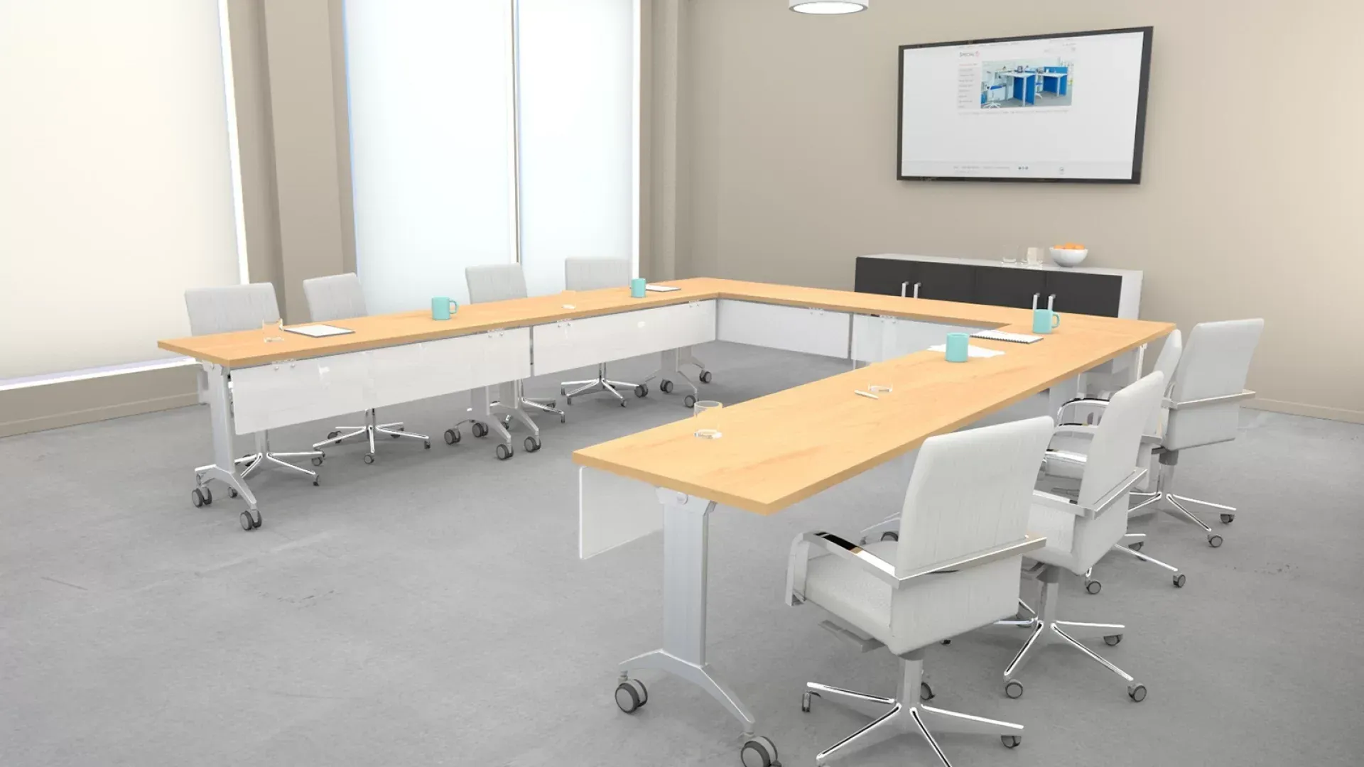 Modern conference room with a U-shaped wooden table, white chairs, and a wall-mounted screen