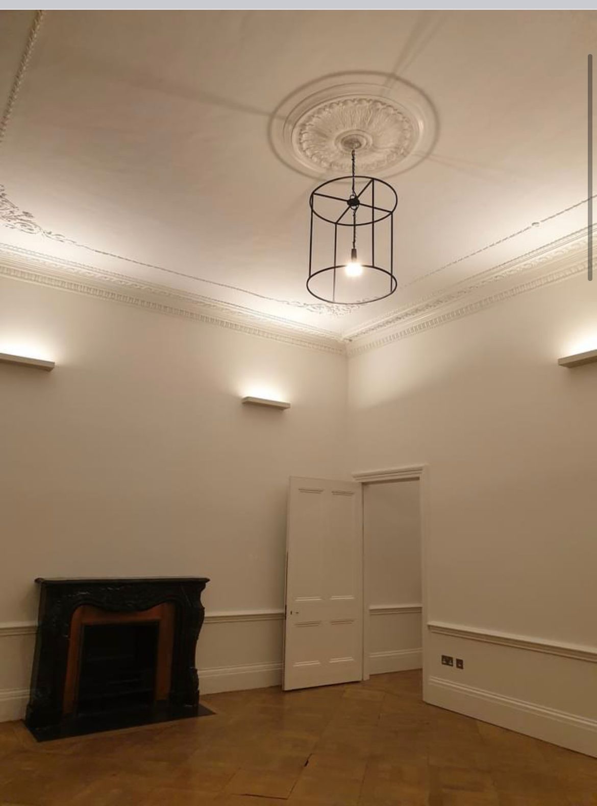 Picture of a living room and fireplace painted by painters and decorators London