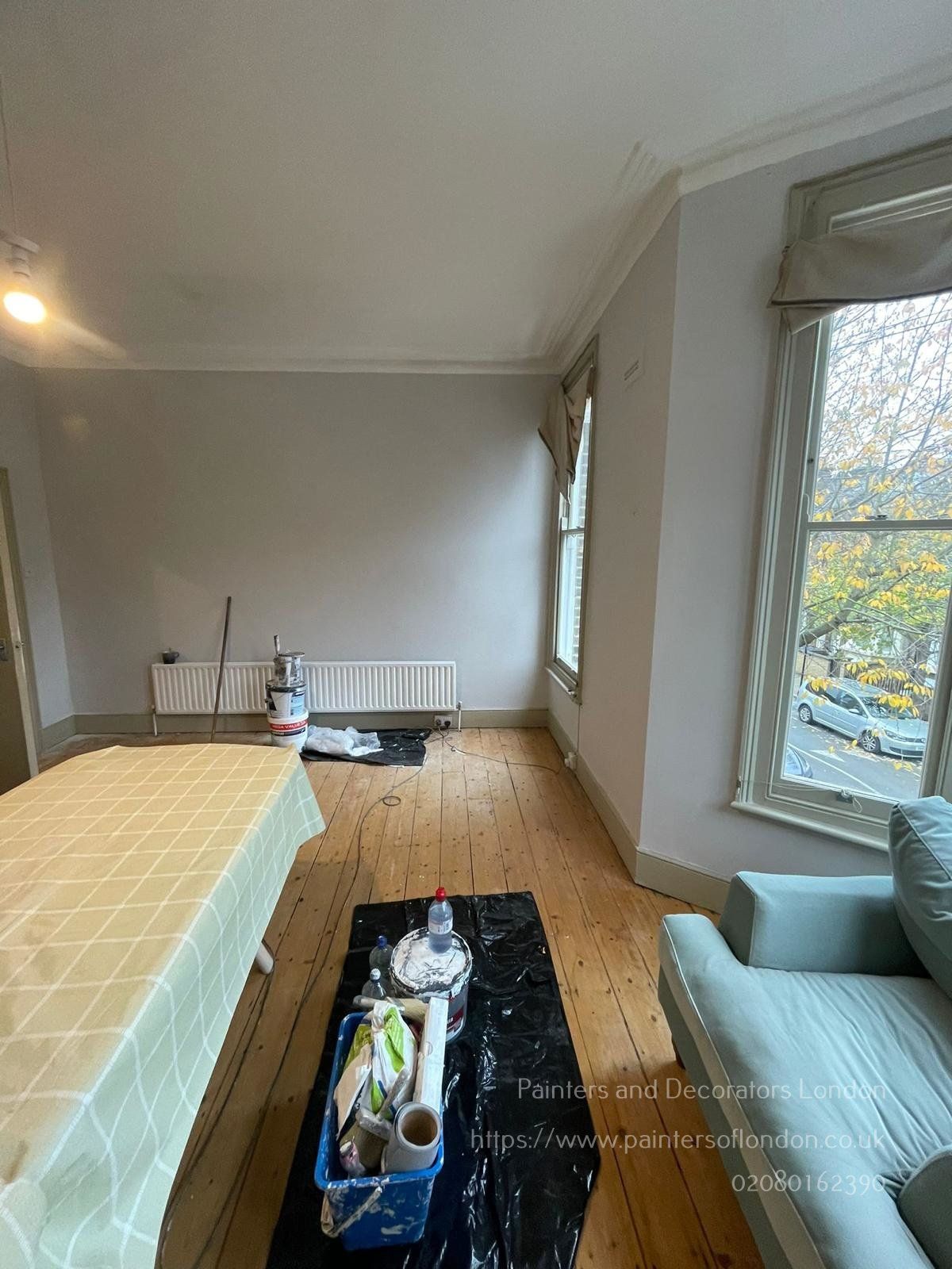 Living room and bay window painting by Painters and Decorators London