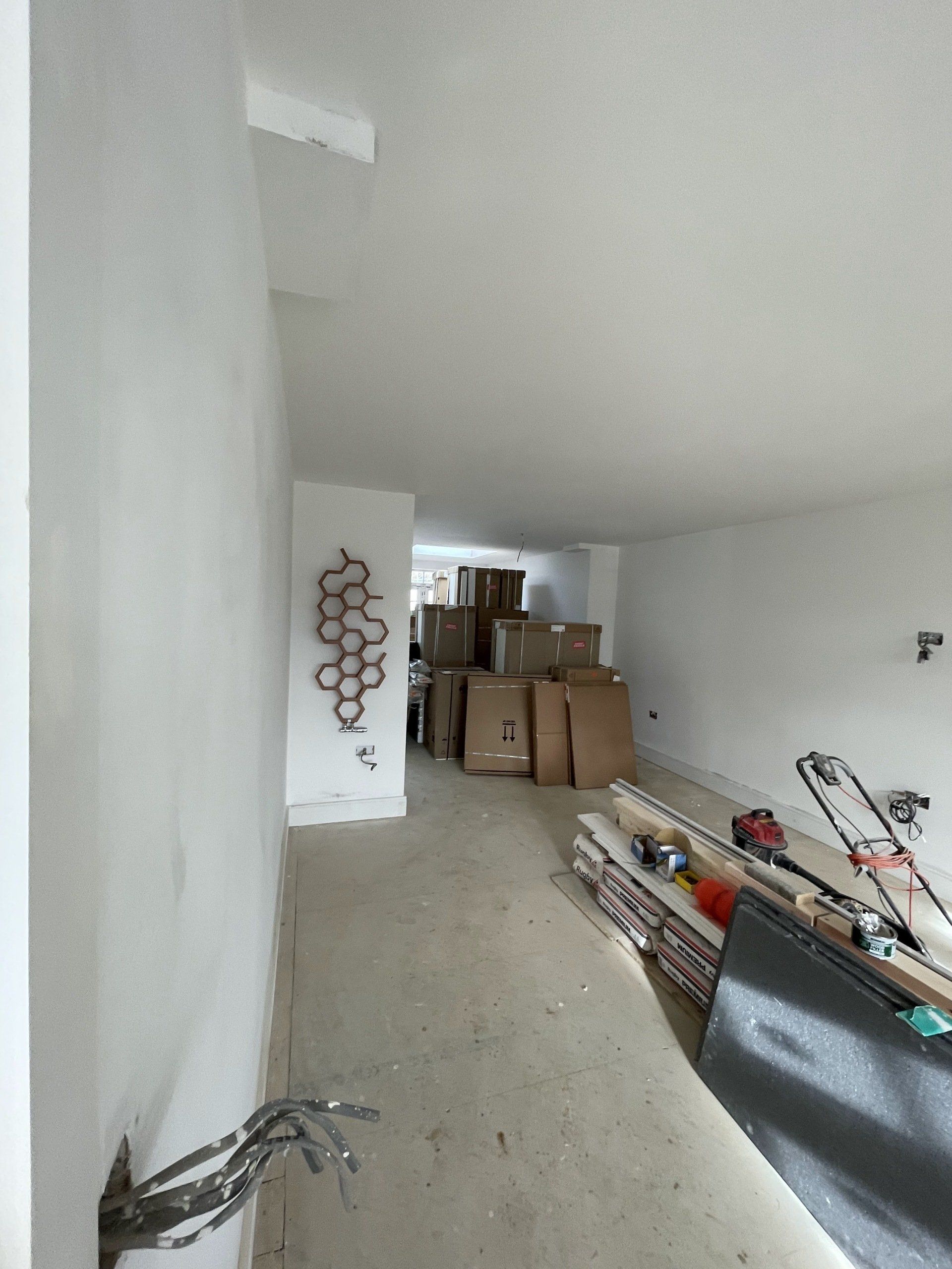 A picture of living room being painted in white by painters and decorators London