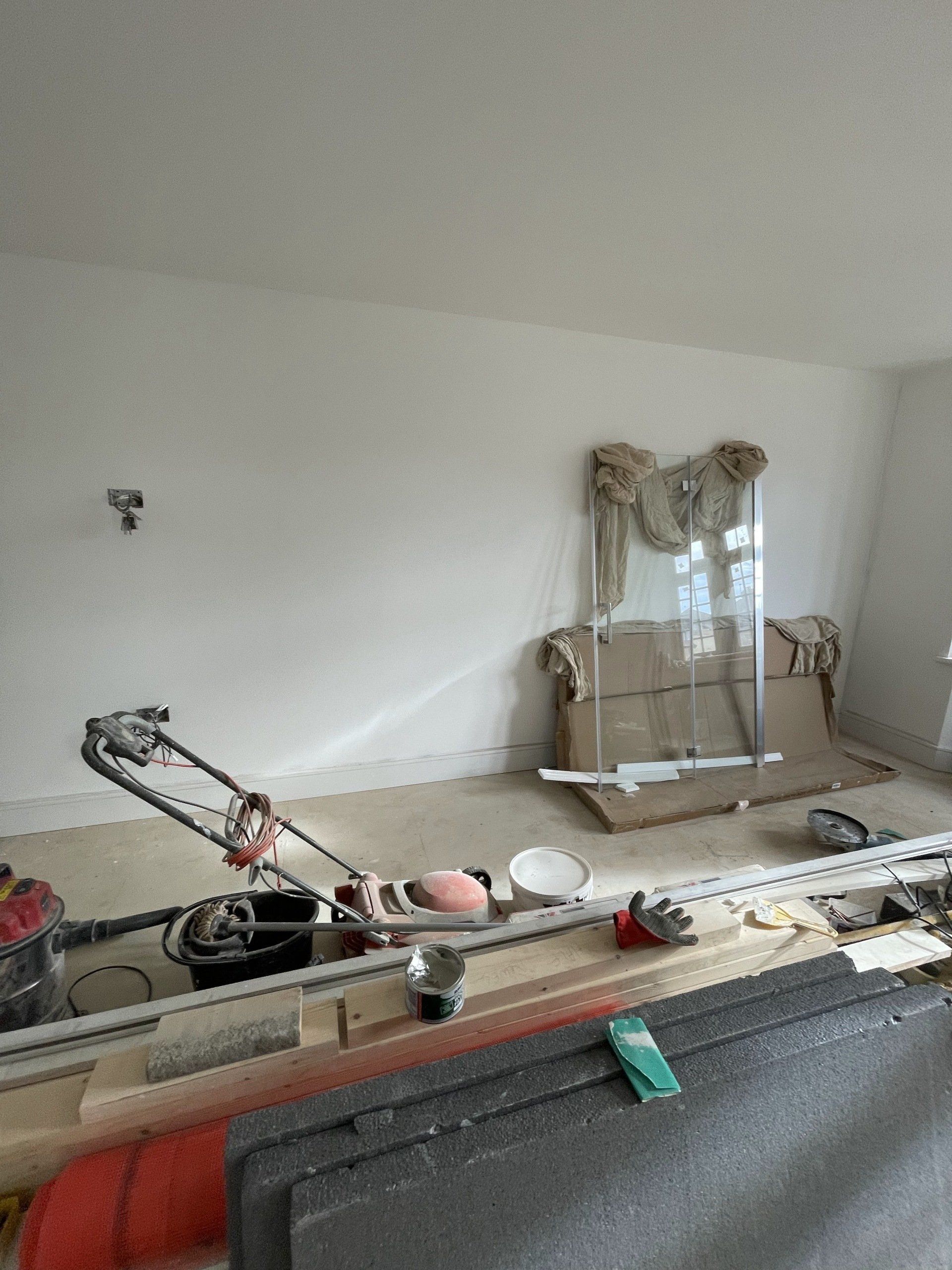 A picture of living room being redecorated by painters and decorators London