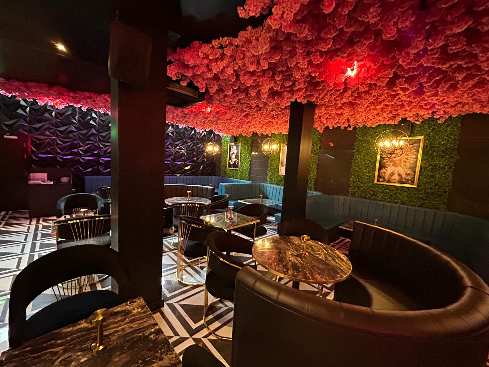Interior decorating of a shisha lounge in black and pink by painters and decorators London