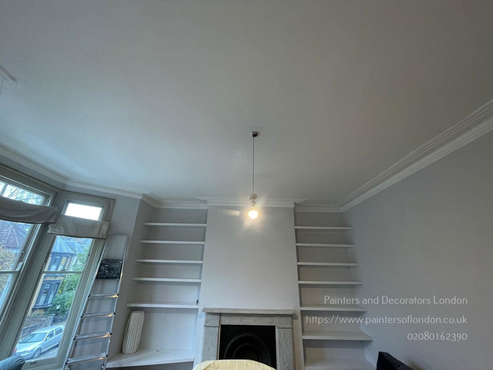 Living room feature wall painting in white by Painters and Decorators London