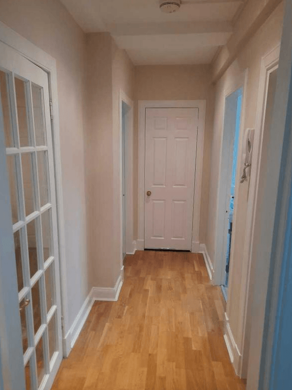 Picture of a hallway painted in white by painters and decorators London