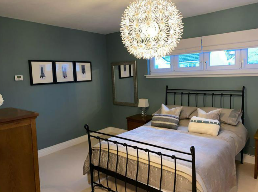 Picture of a master bedroom painted in grey and white by painters and decorators London