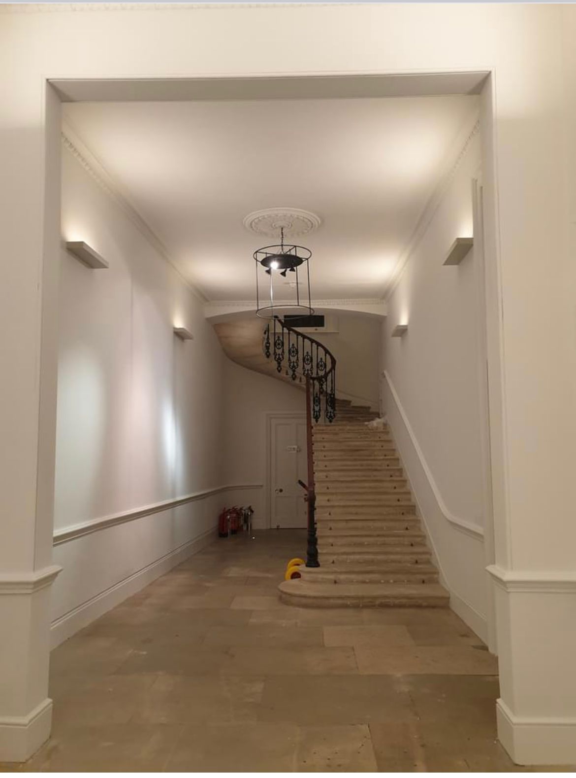  a picture of an entrance hallway painted white by Painters and Decorators London