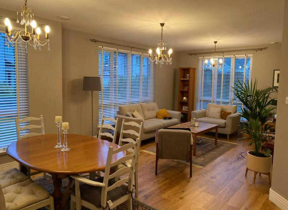 Picture of an open plan dining and living room painted in magnolia by painters and decorators London