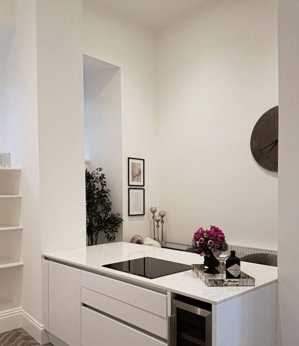 Picture of a contemporary kitchen in white by painters and decorators London